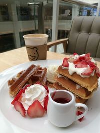 Close-up of breakfast served on table