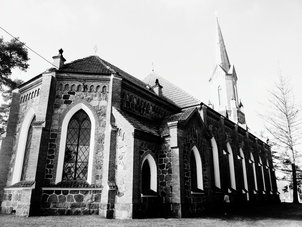 building exterior, architecture, built structure, low angle view, church, religion, place of worship, spirituality, facade, window, clear sky, sky, arch, old, outdoors, day, history, exterior