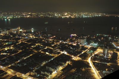 High angle view of illuminated city buildings at night