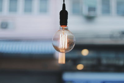 Close-up of light bulb against blurred background