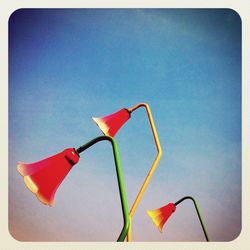 Low angle view of pole against blue sky