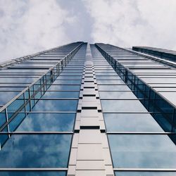 Low angle view of building against cloudy sky