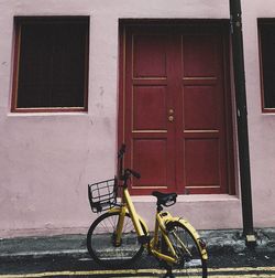 Bicycle with closed door of building