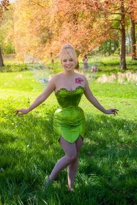 Portrait of smiling young woman on field