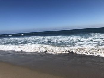 Scenic view of sea against clear sky