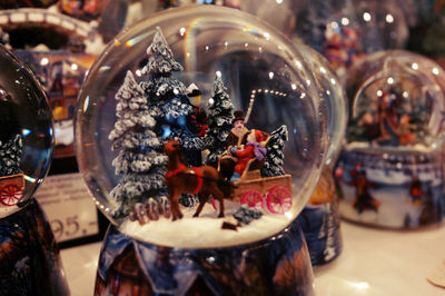 Close-up of snow globes on table for sale