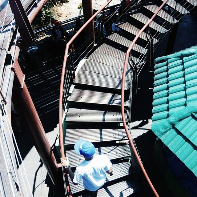 built structure, low angle view, architecture, railing, building exterior, metal, staircase, indoors, steps, steps and staircases, day, building, no people, arts culture and entertainment, sunlight, spiral staircase, modern, spiral, technology, metallic