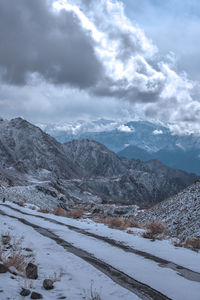 Scenic view of snowcapped mountains against sky