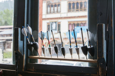 Close-up of clothes drying on window sill