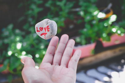 Close-up of hand holding heart shape