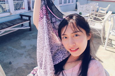 Portrait of smiling young woman outdoors