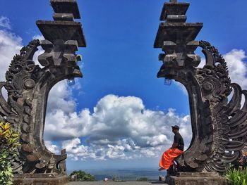 Low angle view of statue against blue sky