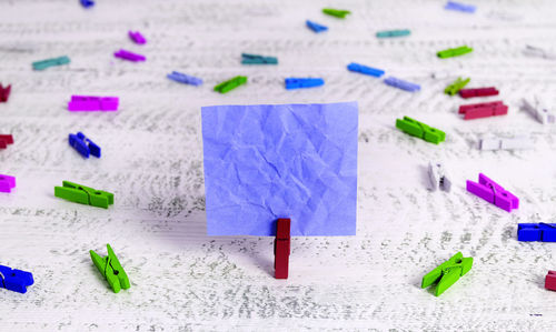 High angle view of multi colored paper on table