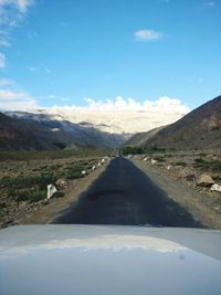 Road amidst landscape against sky