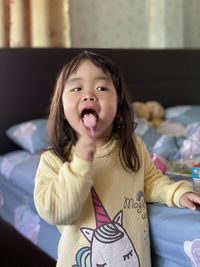 Girl eating dessert while standing at home