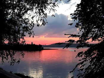 Scenic view of lake against sky during sunset