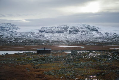 Scenic view of snowcapped mountains against sky during winter
