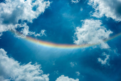 Low angle view of rainbow in sky