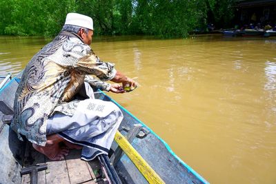 Man fishing in river