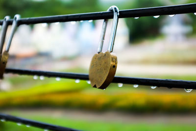 Close-up of rope hanging from railing