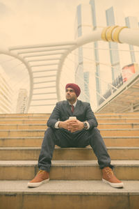 Man sitting on staircase
