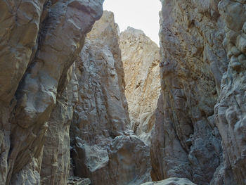 Low angle view of rock formations on sunny day