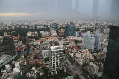 High angle view of buildings in city against sky