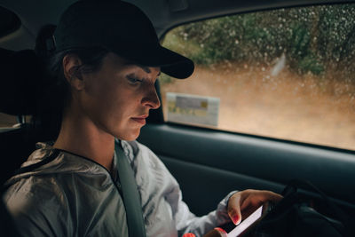 Portrait of senior woman in car