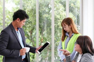 Business coworkers discussing in office