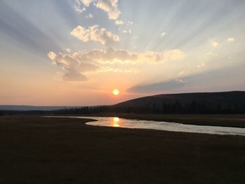 Scenic view of landscape against sky during sunset