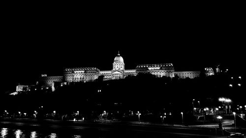 Illuminated cathedral against sky at night