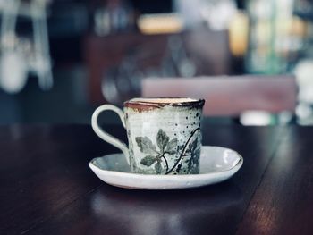 Close-up of coffee cup on table