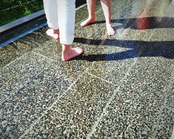 Low section of women standing outdoors