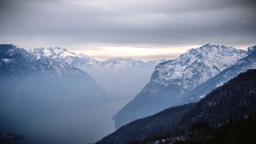 Scenic view of snowcapped mountains against sky