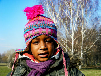 Portrait of young woman wearing hat