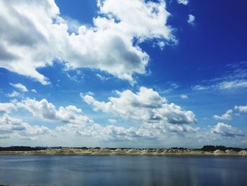 Scenic view of sea against blue sky