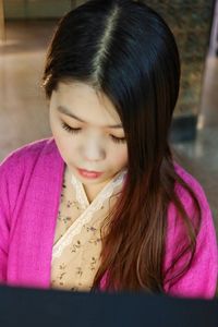 Close-up of young woman with long hair