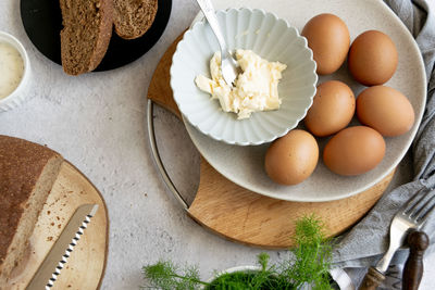 High angle view of eggs in plate on table