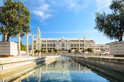 View of swimming pool against buildings