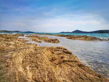 Scenic view of beach against sky