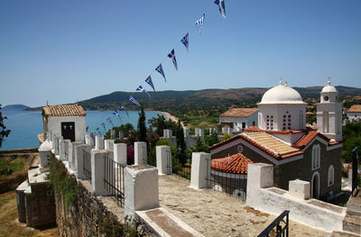 Panoramic view of buildings in city against clear sky