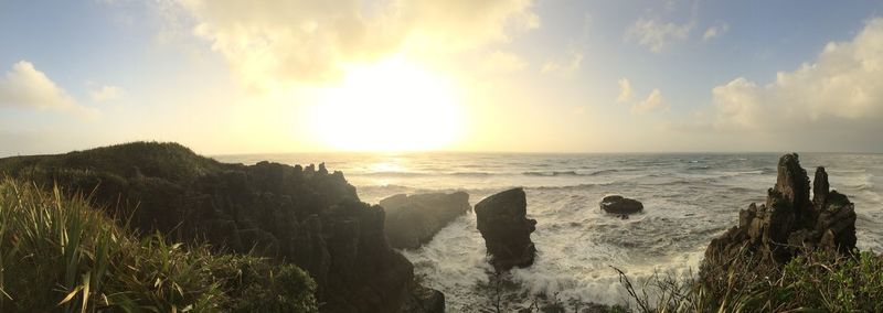 Panoramic view of sea against sky during sunset