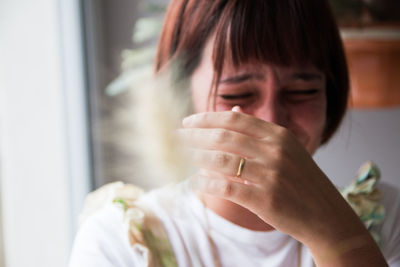 Close-up of young woman crying