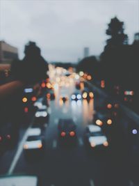 Defocused image of cars on road at night