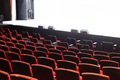 Empty theater seats with white background