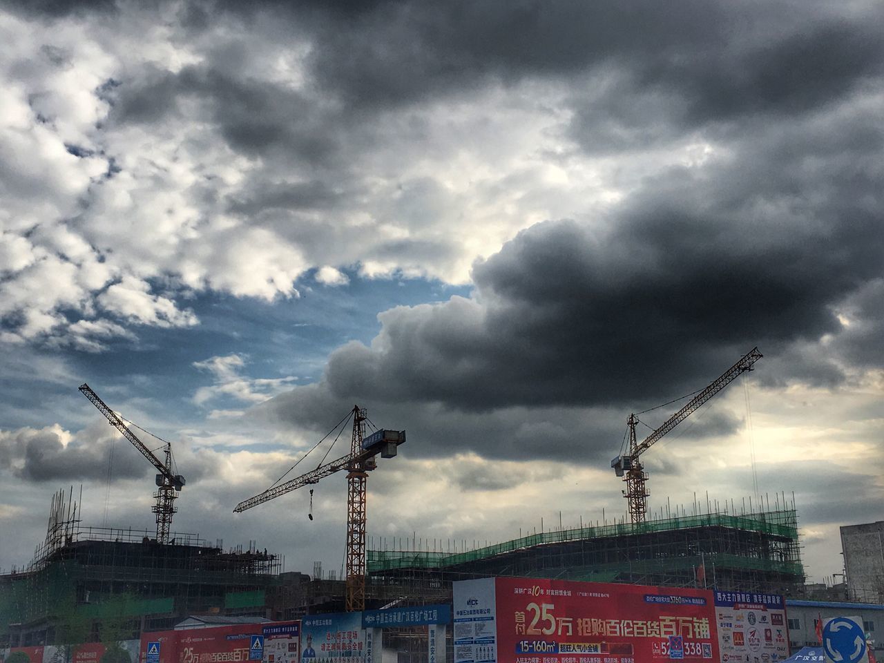 sky, cloud - sky, cloudy, weather, built structure, architecture, building exterior, overcast, low angle view, cloud, storm cloud, transportation, cloudscape, city, outdoors, dramatic sky, no people, day, nature, mode of transport