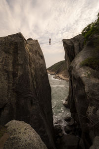 Scenic view of cliff against sky