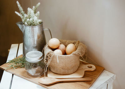 Potted plant in basket on table
