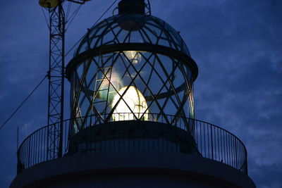 Low angle view of illuminated building against sky