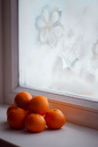 Close-up of orange fruits on table